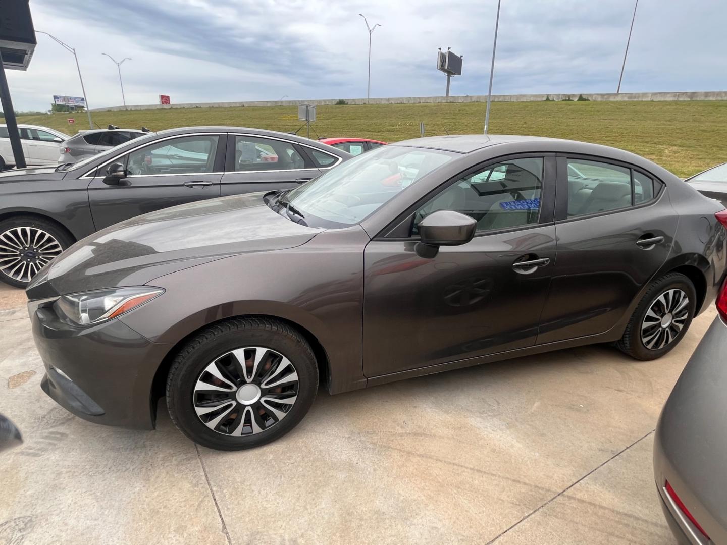 2015 BEIGE MAZDA MAZDA3 I SPORT W/SKY i Sport AT 4-Door (3MZBM1U73FM) with an 2.0L L4 DOHC 16V engine, 6-Speed Automatic transmission, located at 8101 E. Skelly Dr., Tulsa, OK, 74129, (918) 592-3593, 36.121891, -95.888802 - Photo#1